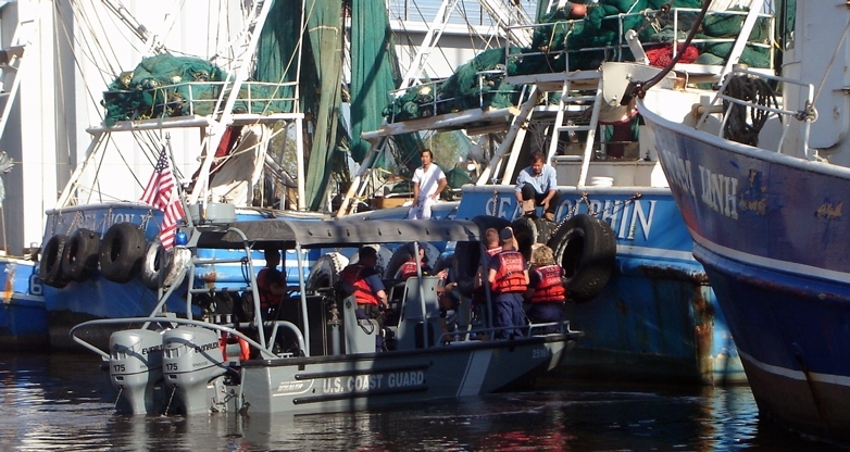 Coast Guard inspects shrimp boats in the aftermath after Katrina.