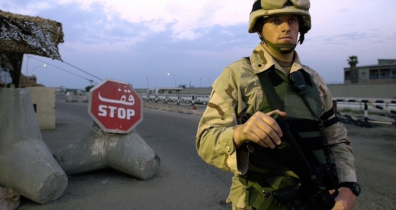 ASH SHUAIBA, Kuwait (March 26, 2004)-Port Security Specialist 2nd Class Steven Gruber, 28, from Ft. Myers, of Coast Guard Port Security Unit (PSU) 307 from St. Petersburg, Fla., stands watch at a checkpoint.