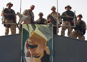 North Arabian Gulf - Coast Guard members from Port Security Unit 313, from Tacoma, Wa., stand above the catwalk at the Mina al Bakr oil terminal. Coast Guard Port Security Units maintained security on oil terminals. 